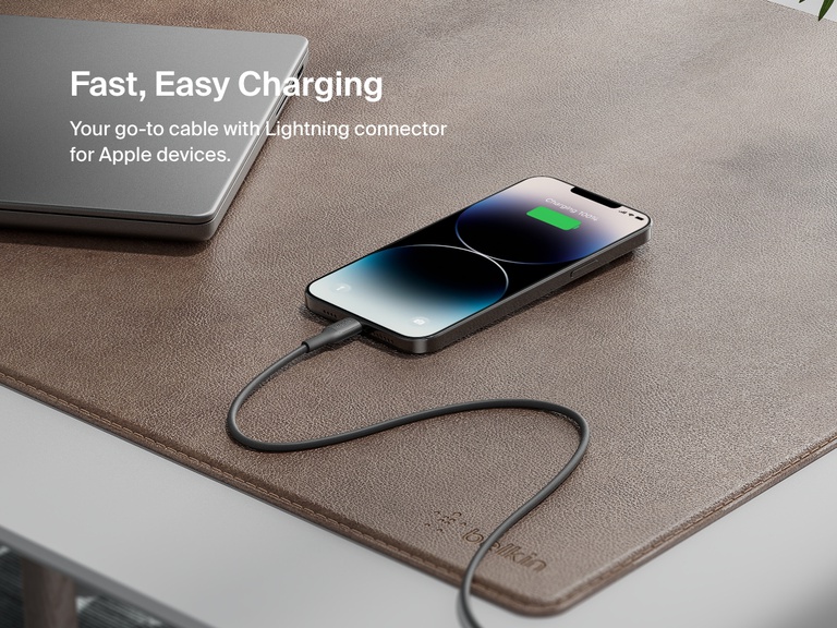 Belkin BoostCharge USB-C to USB-C Cable 240W shown charging MacBook Pro 14", iPhone 16 Pro Max, and Galaxy S25 from 0–50% in under 31 minutes, highlighting ultra-fast charging performance.