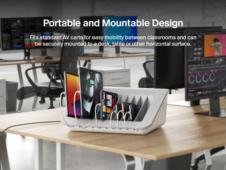 The Belkin Store and Charge Station sits on a modern office desk charging multiple tablets and smartphones, showcasing its portable, mountable design ideal for classrooms, offices, and shared workspaces.