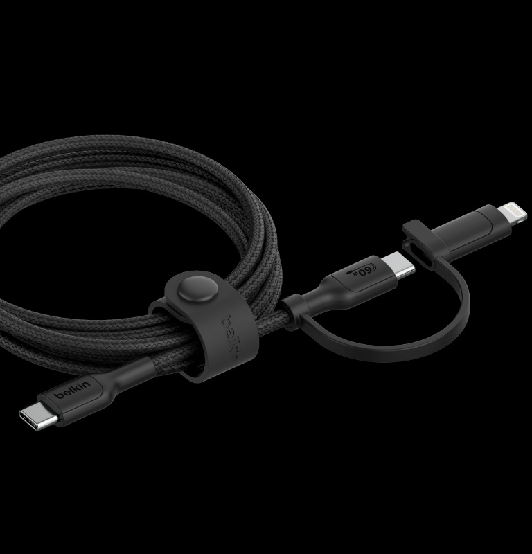 A BoostCharge Pro 2-in-1 Cable with USB-C and Lightning Connector, neatly coiled and secured with a silicone strap for cable management, displaying both connectors on a black background.