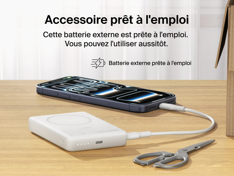 Slim Magnetic Power Bank 10K with Qi2 charging smartphone on desk with precharged battery indicator lights visible