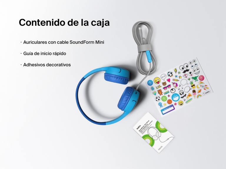 Flat lay image showing the contents of the Belkin SoundForm Mini Wired Headphones box, including the headphones, a quick start guide, and a sheet of decorative stickers.