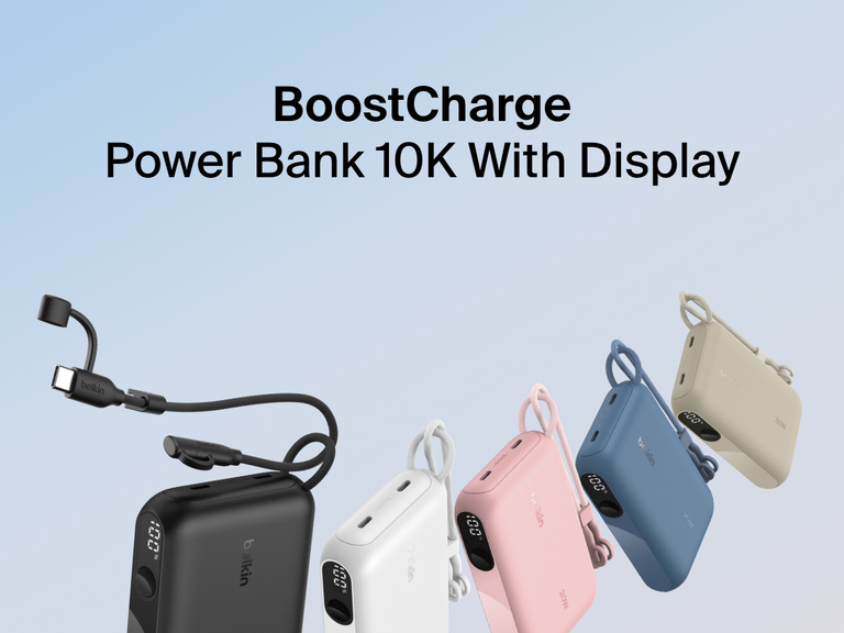 Belkin BoostCharge Power Bank 10K with Display shown in five colors—black, white, pink, blue, and sand—featuring a built-in USB-C cable, LED battery percentage display, and compact design for on-the-go charging.