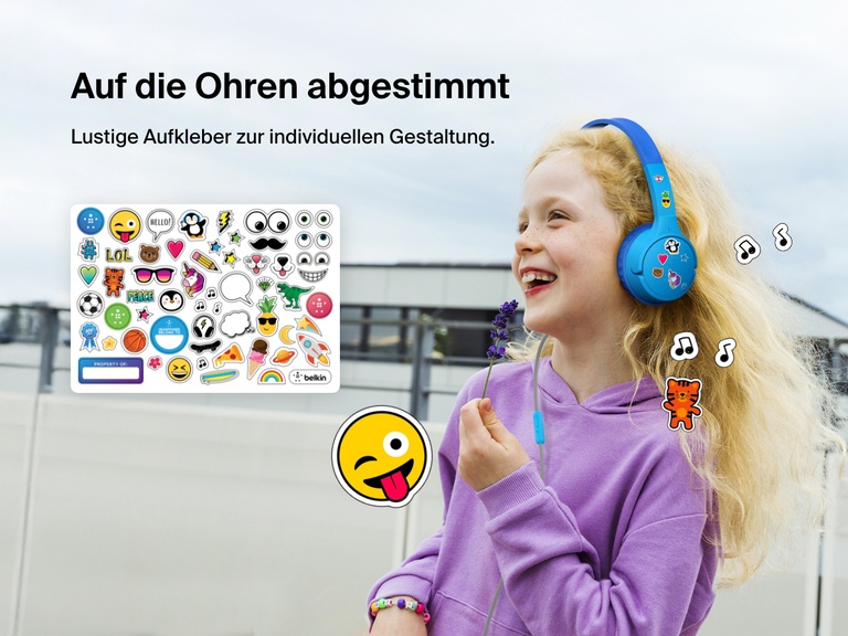 Smiling girl wearing Belkin Wired On-Ear Headphones for Kids decorated with colorful stickers, highlighting the headset’s personalization feature with included fun sticker sheet.