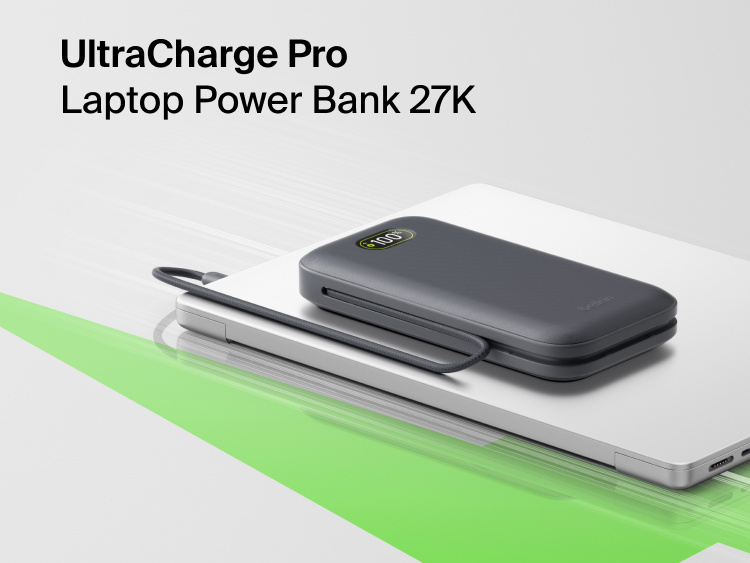 UltraCharge Pro Laptop Power Bank 27K portable charger with integrated cable and digital display resting on a laptop for high-capacity on-the-go charging