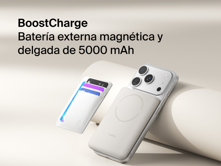 Belkin BoostCharge Slim Magnetic Power Bank 5K with Qi2 wirelessly attached to a smartphone, featuring a slim magnetic design with integrated card storage for portable on-the-go charging.