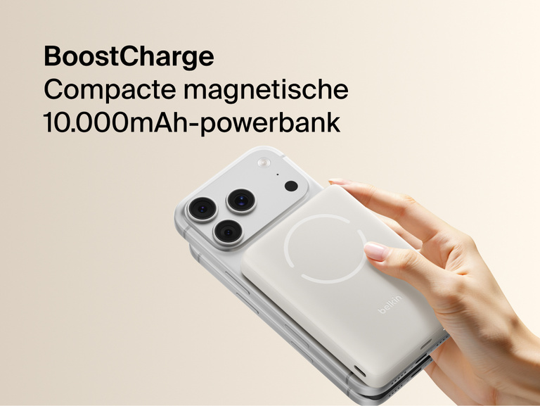 Belkin BoostCharge Slim Magnetic Power Bank 10K magnetically attached to iPhone showing slim portable design for wireless charging