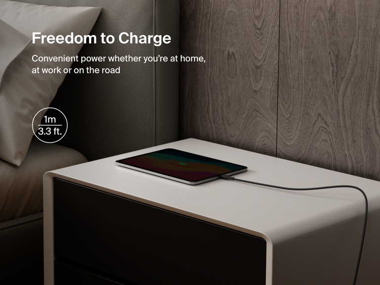 Belkin BoostCharge Pro USB-C to USB-C Braided Cable 240W shown charging a tablet on a nightstand, emphasizing its 1-meter (3.3 ft) length for convenient charging anywhere.