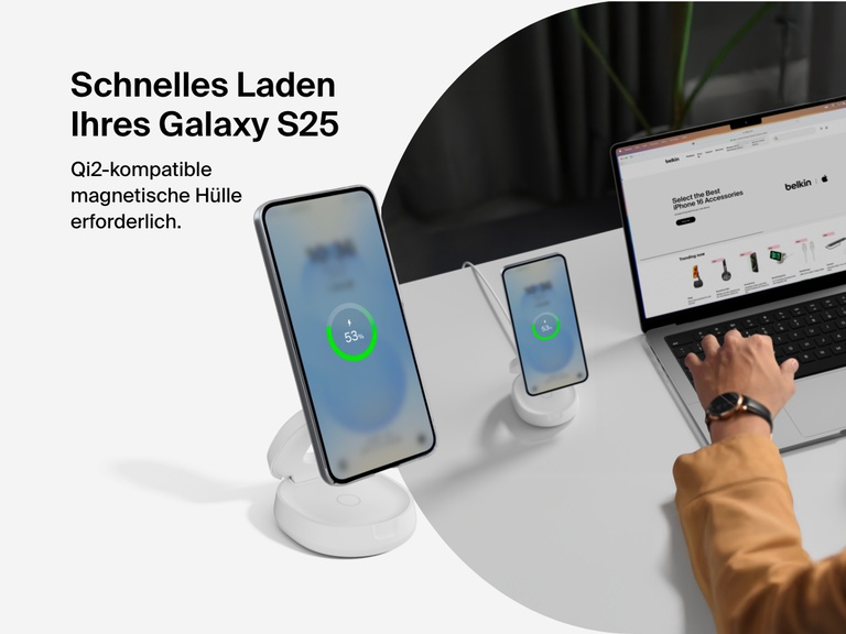 Belkin BoostCharge 2-in-1 Convertible Magnetic Charging Stand with Qi2 15W shown fast charging a Galaxy S25 in a Qi2-compatible magnetic case at a desktop workspace.