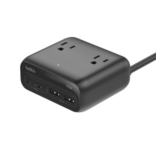 A black Belkin charging station featuring two AC outlets on top and two USB-C ports plus two USB-A ports on the front. The unit has a compact, rounded design with an attached power cord.