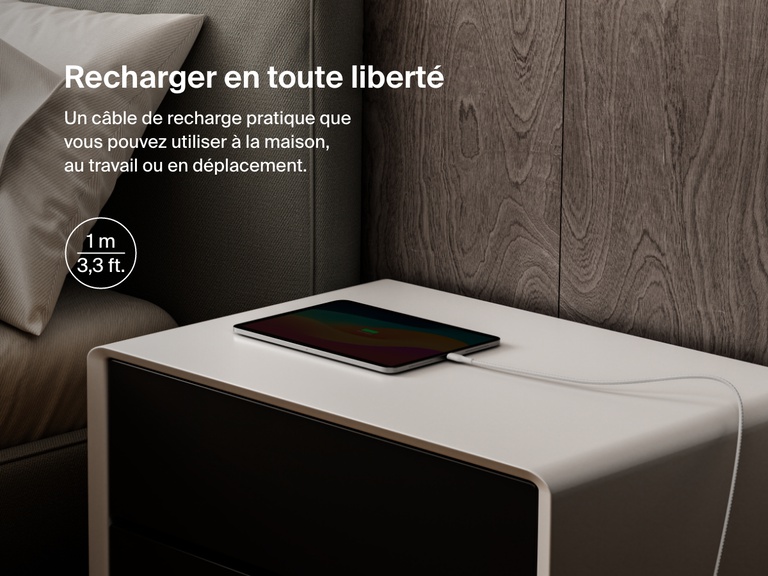 Belkin BoostCharge Pro USB-C to USB-C Braided Cable 240W shown charging a tablet on a nightstand, emphasizing its 1-meter (3.3 ft) length for convenient charging anywhere.