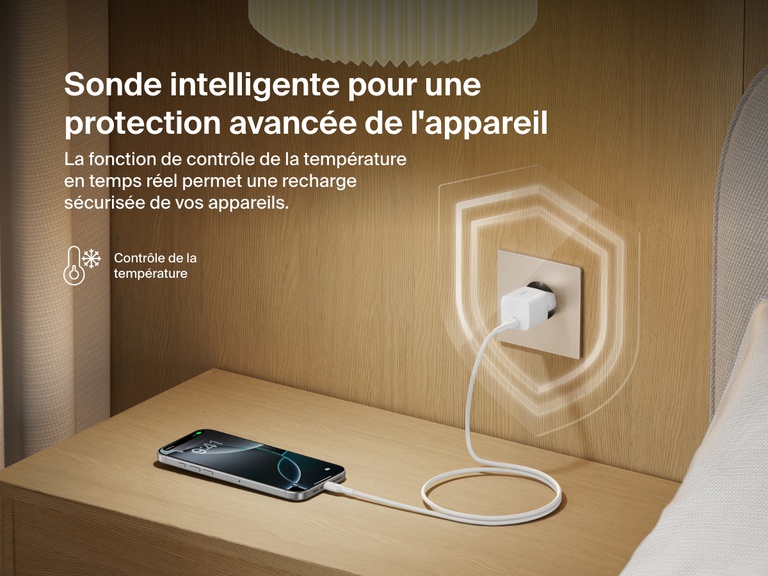 Belkin BoostCharge USB-C Wall Charger 25W plugged into a bedside outlet, showcasing real-time temperature monitoring for advanced device protection and safe charging.