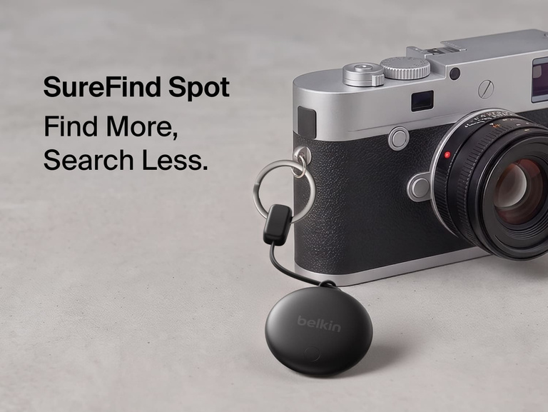 Belkin SureFind Spot attached to a camera with secure lanyard, designed to help locate everyday essentials.