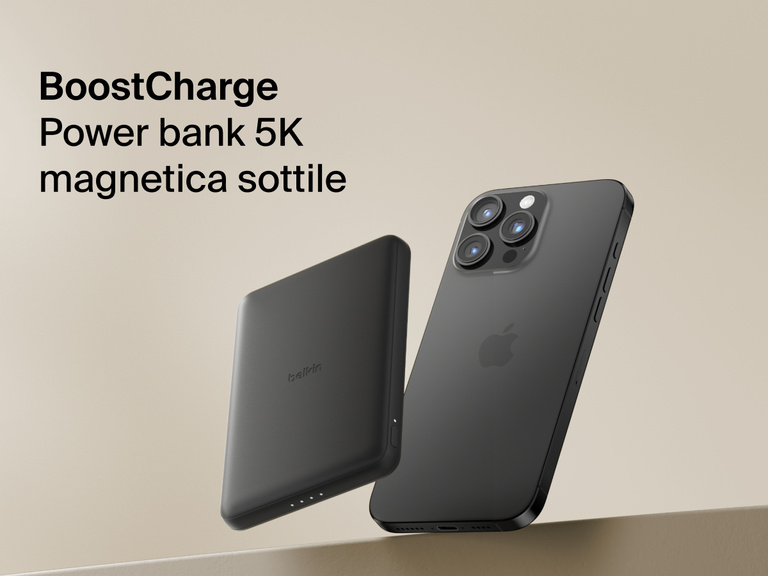 Belkin BoostCharge Slim Magnetic Power Bank 5K shown magnetically attached to a smartphone beside a slim wallet accessory, highlighting its compact portable charging design.