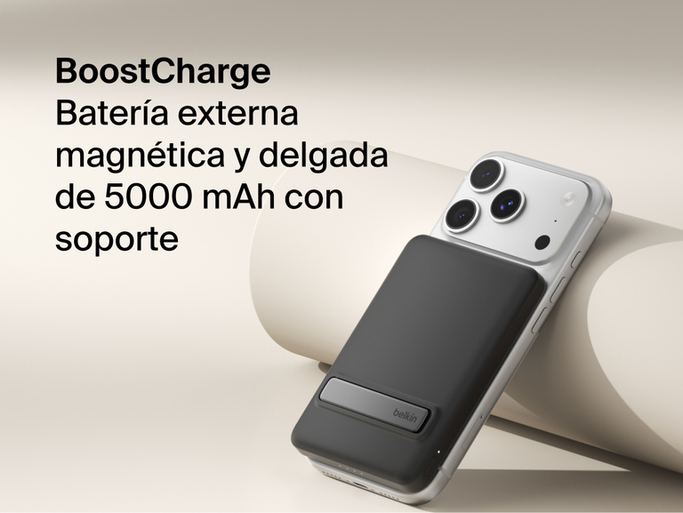 Belkin BoostCharge Slim Magnetic Power Bank 5K with Qi2 wirelessly attached to a smartphone, featuring a slim magnetic design with integrated card storage for portable on-the-go charging.