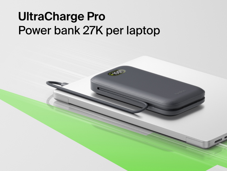 UltraCharge Pro Laptop Power Bank 27K portable charger with integrated cable and digital display resting on a laptop for high-capacity on-the-go charging