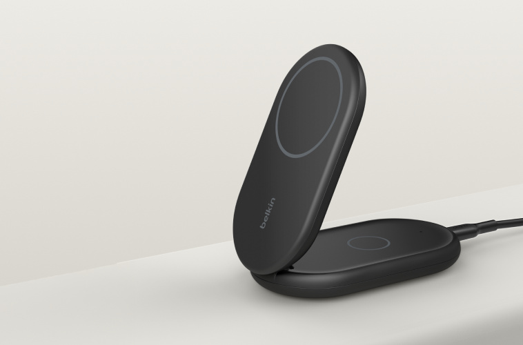 BoostCharge 2-in-1 Magnetic Foldable Wireless Charger with Qi2 15W shown in black, featuring a sleek foldable design with two charging surfaces and a connected cable against a neutral background.