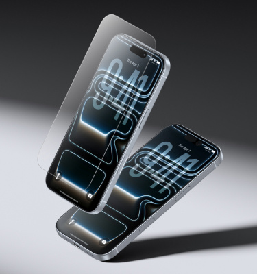 Two smartphones with Belkin screen protectors shown in mid-air under a spotlight, highlighting their durable, shatter-resistant protection.