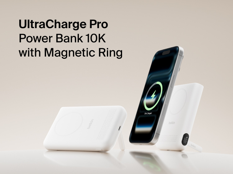 Belkin UltraCharge Pro Power Bank 10K with magnetic ring shown wirelessly charging a smartphone, featuring a slim portable battery design for on-the-go fast charging.