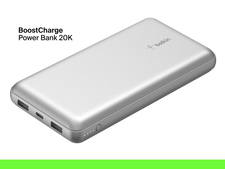 A silver Belkin BoostCharge Power Bank 20K with dual USB-A ports, a USB-C port, LED battery indicator lights, and a power button is shown on a white background.