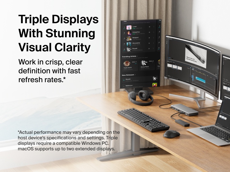 A home office setup featuring a Thunderbolt 4 dock connected to a laptop, keyboard, and monitor on a wooden desk, with storage shelves and decor in the background.