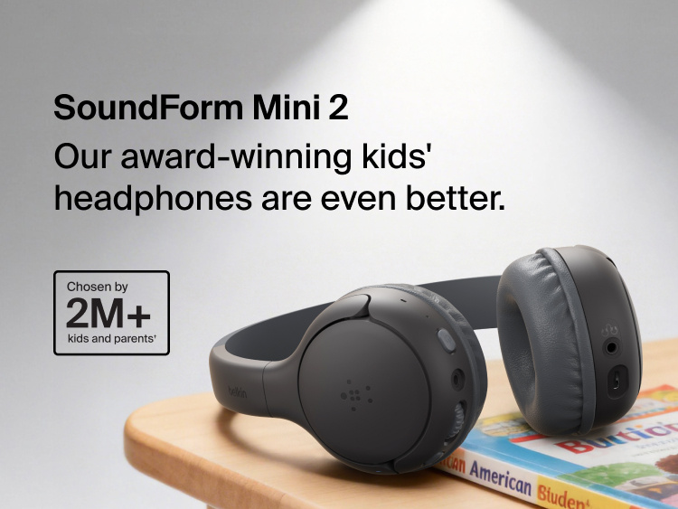 SoundForm Mini 2 Wireless On-Ear Headphones for Kids resting on a wooden surface beside a children's book, with on-image text reading Our award-winning kids' headphones are even better and Chosen by 2M+ kids and parents