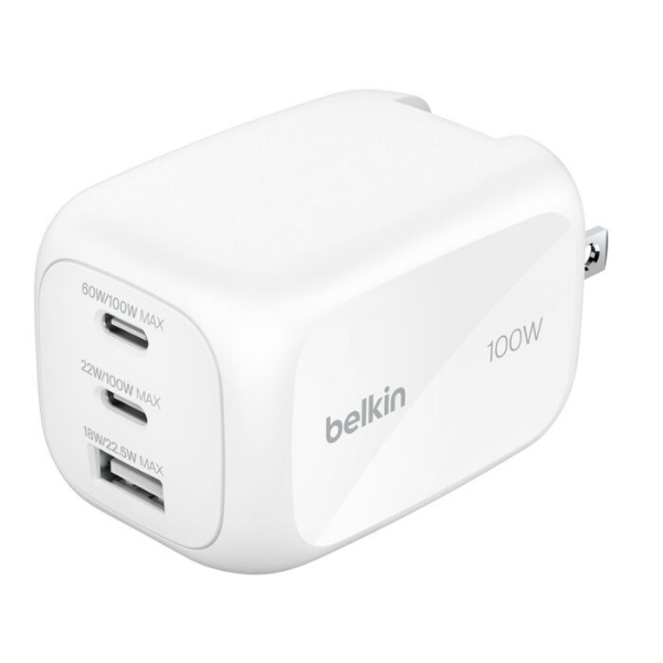 A white Belkin 100W GaN wall charger with two USB-C ports and one USB-A port on the front, each labeled with its maximum wattage. The charger has smooth rounded edges and foldable prongs.