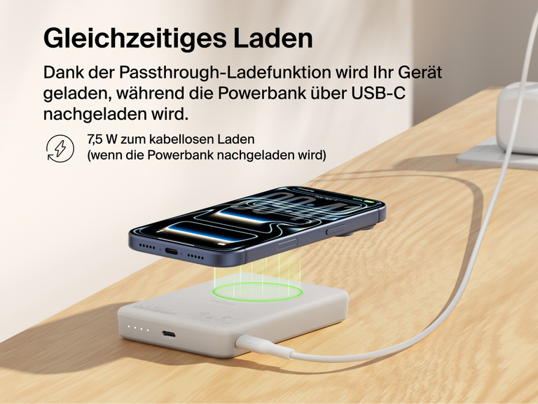 Belkin BoostCharge Slim Magnetic Power Bank 10K delivering pass-through charging with a smartphone wirelessly charging on top while the power bank recharges via USB-C cable