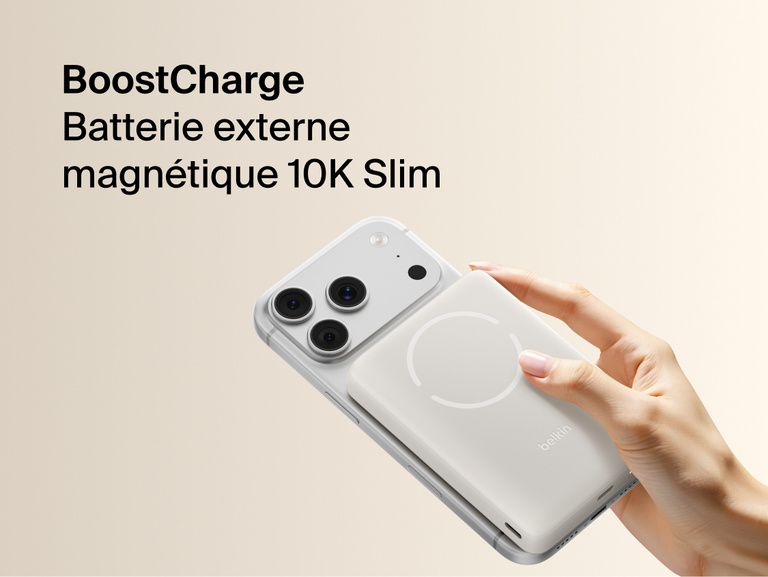 Slim Magnetic Power Bank 10K with Qi2 magnetically attached to smartphone held in hand demonstrating wireless charging alignment