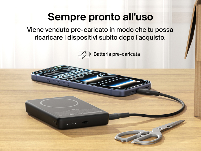 Slim Magnetic Power Bank 10K with Qi2 charging smartphone on desk with precharged battery indicator lights visible