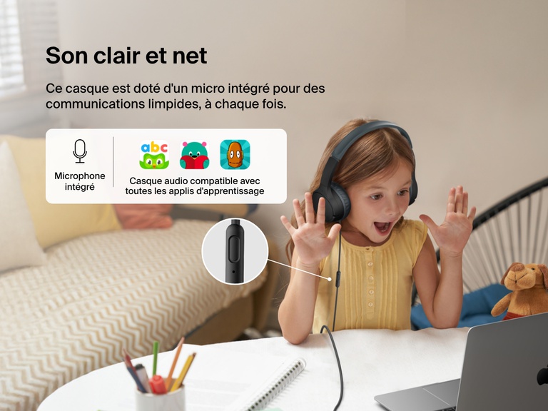 Young girl using Belkin Wired On-Ear Headphones for Kids with a built-in microphone while video chatting on a laptop, highlighting clear audio and compatibility with learning apps for classroom use.