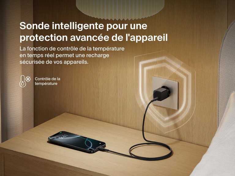Belkin BoostCharge USB-C Wall Charger 25W plugged into a bedside outlet, showcasing real-time temperature monitoring for advanced device protection and safe charging.