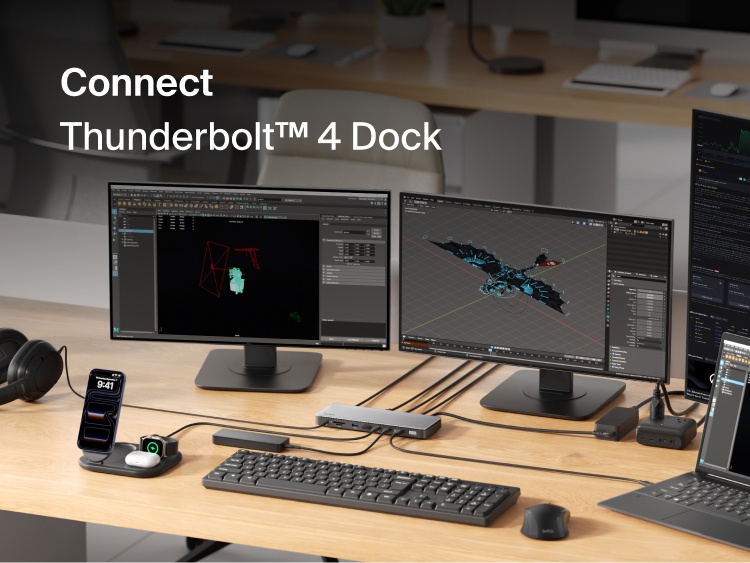A Thunderbolt 4 dock setup connecting a laptop to multiple external monitors on a desk, displaying creative and productivity applications.