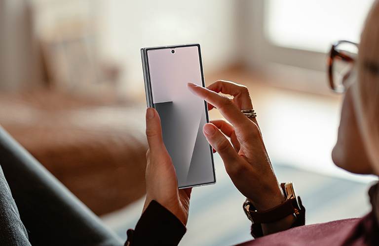 Image of a Samsung Galaxy S25 Edge with a glowing silver ball impacting the screen, illustrating that the screen protector is up to 62% stronger than conventional tempered glass.