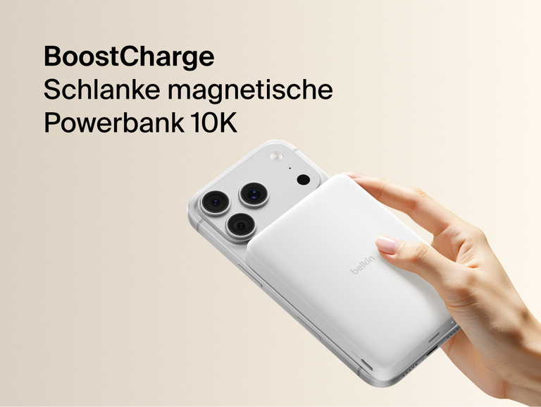 Belkin BoostCharge Slim Magnetic Power Bank 10K magnetically attached to iPhone, demonstrating secure wireless charging with a slim portable design