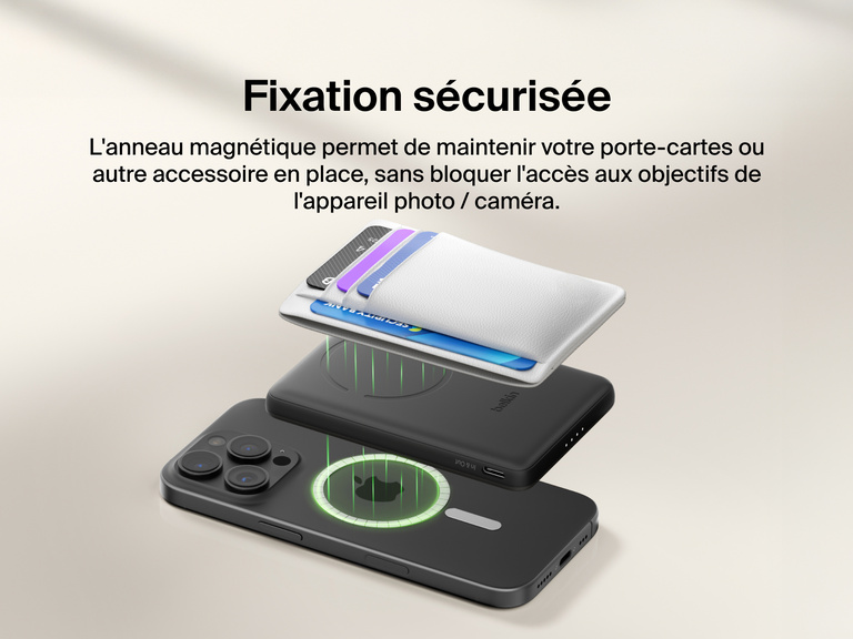 Belkin BoostCharge Slim Magnetic Power Bank 5K shown magnetically aligned between a smartphone and wallet accessory, demonstrating precise magnetic ring for secure attachment and camera-safe design.