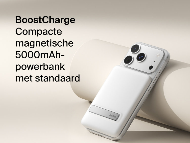 Belkin BoostCharge Slim Magnetic Power Bank 5K with Qi2 wirelessly attached to a smartphone, featuring a slim magnetic design with integrated card storage for portable on-the-go charging.