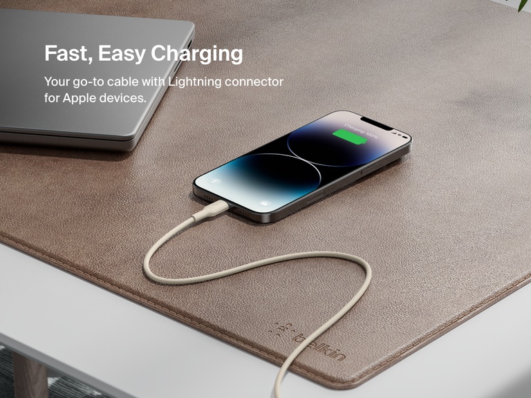 Belkin BoostCharge USB-C to USB-C Cable 240W shown charging MacBook Pro 14", iPhone 16 Pro Max, and Galaxy S25 from 0–50% in under 31 minutes, highlighting ultra-fast charging performance.