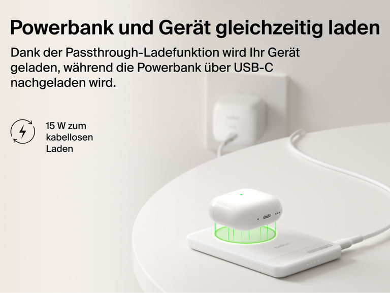Belkin BoostCharge Slim Magnetic Power Bank 5K with Qi2 demonstrating pass-through charging, wirelessly powering a device while the power bank recharges via USB-C.