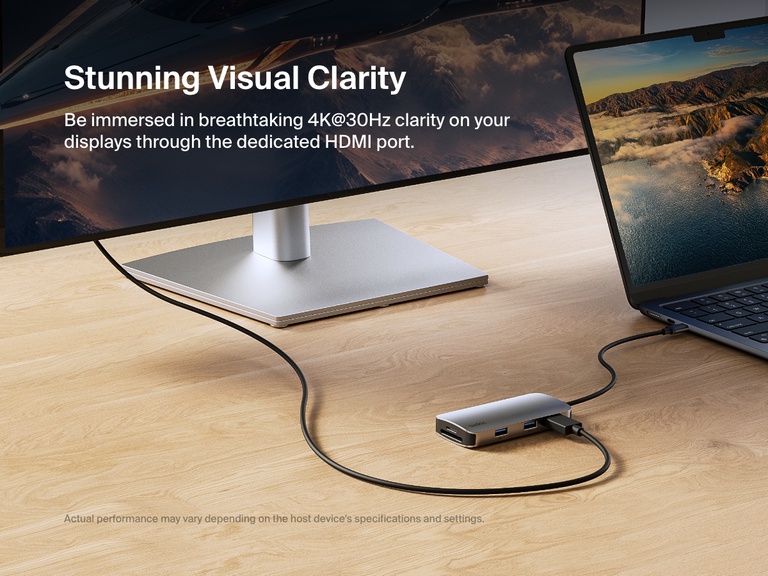 A Belkin Connect USB-C 5-in-1 Multiport Hub is connected to a laptop and an external monitor, showcasing its ability to deliver stunning 4K@60Hz visual clarity through the dedicated HDMI port.