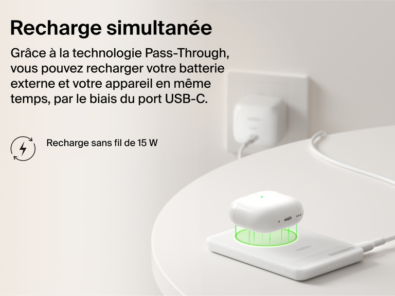 Belkin BoostCharge Slim Magnetic Power Bank 5K with Qi2 demonstrating pass-through charging, wirelessly powering a device while the power bank recharges via USB-C.