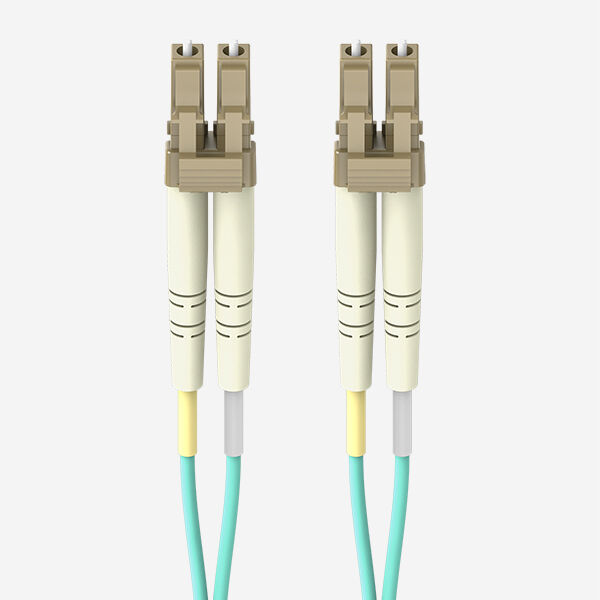A Belkin fiber optic cable with LC duplex connectors, featuring beige and white housing, aqua-colored cables, and yellow and gray strain relief boots, against a white background.