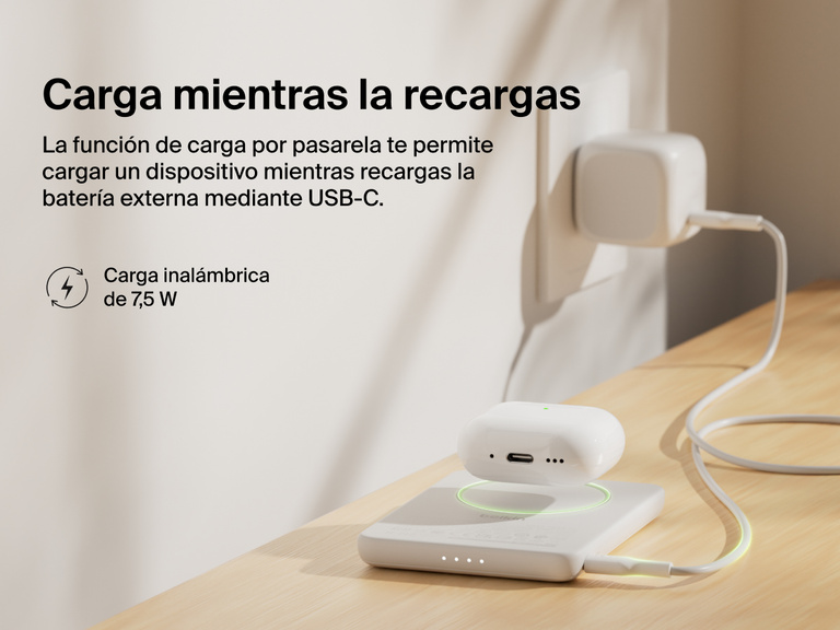 Belkin BoostCharge Slim Magnetic Power Bank 5K shown wirelessly charging earbuds while recharging via USB-C, demonstrating 7.5W pass-through charging functionality.