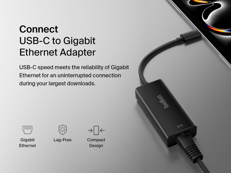 Belkin USB-C to Gigabit Ethernet Adapter is shown connected to a tablet, with callouts highlighting its gigabit Ethernet speed, lag-free performance, and compact design for reliable wired connectivity.