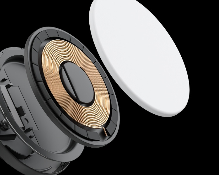 Eine 3D-Nahaufnahme eines kabellosen Ladegeräts mit einer deutlich sichtbaren Kupferspule, die MagSafe- oder kabellose Qi-Technologie darstellen soll. Das Ladegerät sieht so aus, als wäre es in Einzelteile zerlegt. Interne Bauteile sind vor einem schwarzen Hintergrund abgebildet.