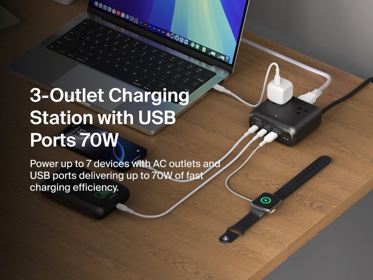Belkin 3-Outlet Charging Station with 2 USB-A and 2 USB-C ports delivering 70W of power sits on a desk, charging a laptop, smartphone, smartwatch, and other devices simultaneously.