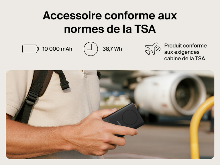 Belkin UltraCharge Pro Power Bank 10K with magnetic ring shown in hand at an airport, highlighting TSA-compliant 10,000 mAh capacity for travel-ready portable charging.