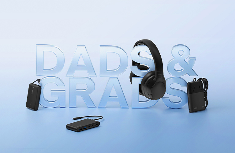 Belkin Dads & Grads promotional banner showcasing premium tech gifts including wireless headphones, a portable power bank, and a USB-C hub on a soft blue gradient background.