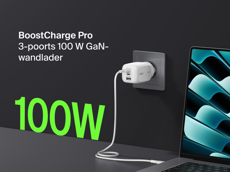 BoostCharge Pro 3-Port GaN Wall Charger 100W plugged into a wall outlet, fast charging a laptop with bold green “100W” text highlighting its powerful output.