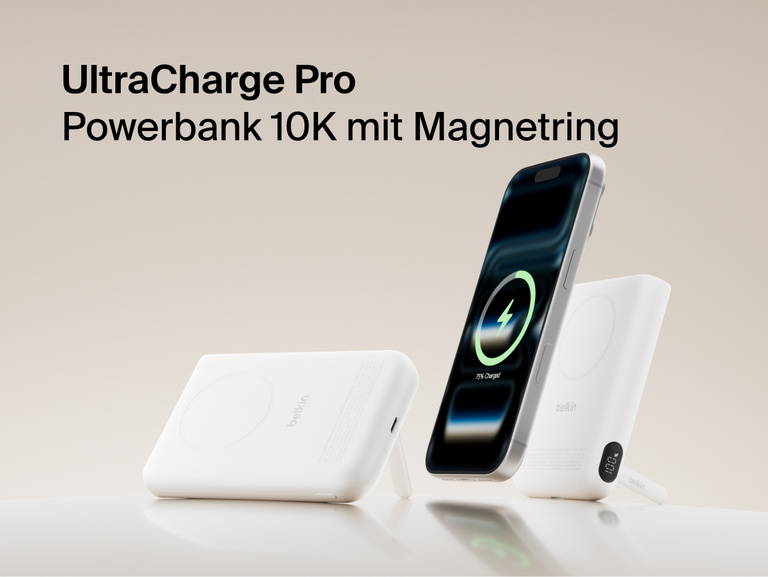 Belkin UltraCharge Pro Power Bank 10K with magnetic ring shown wirelessly charging a smartphone, featuring a slim portable battery design for on-the-go fast charging.