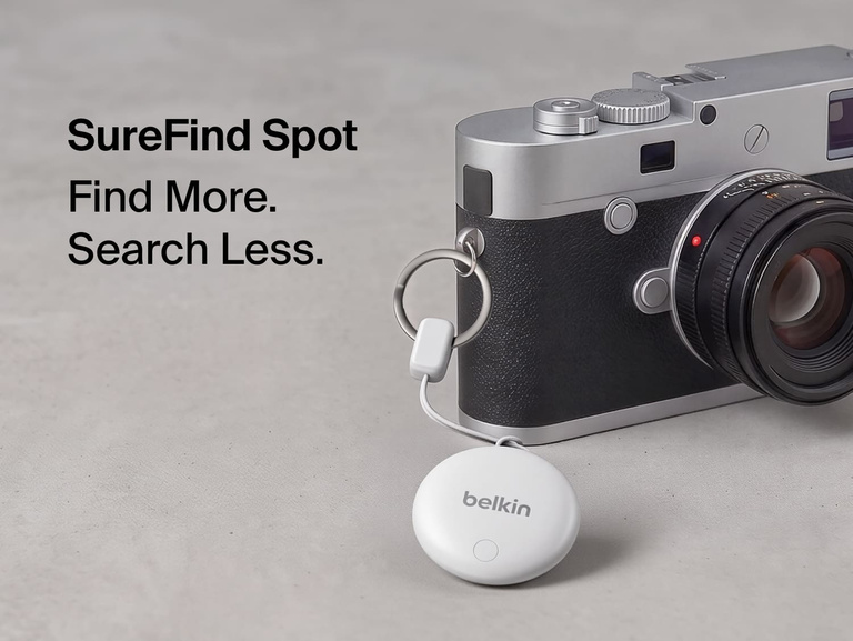 Belkin SureFind Spot attached to a camera with secure lanyard, designed to help locate everyday essentials.